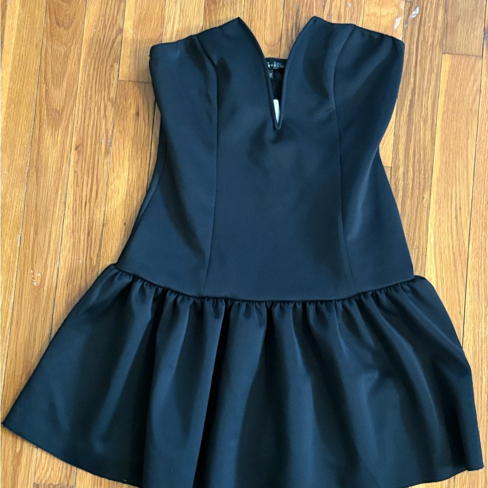 Never worn new with tags peplum black dress